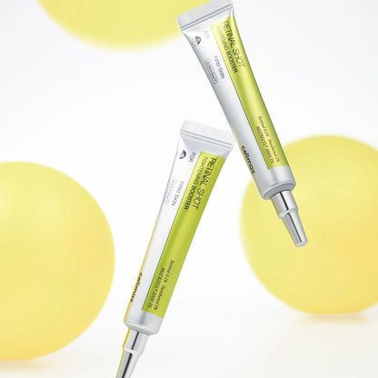 Two skincare serum tubes on a white background with yellow circles
