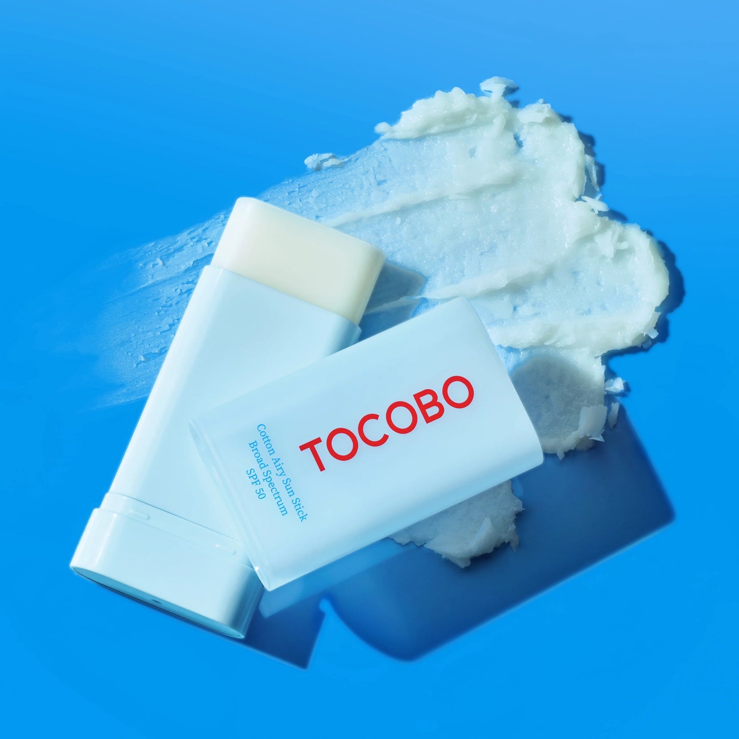 Tocobo skincare product with cream on a blue background