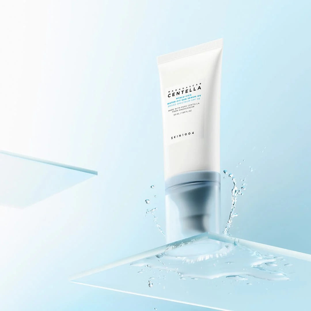 Skincare tube with water droplets on a light blue background