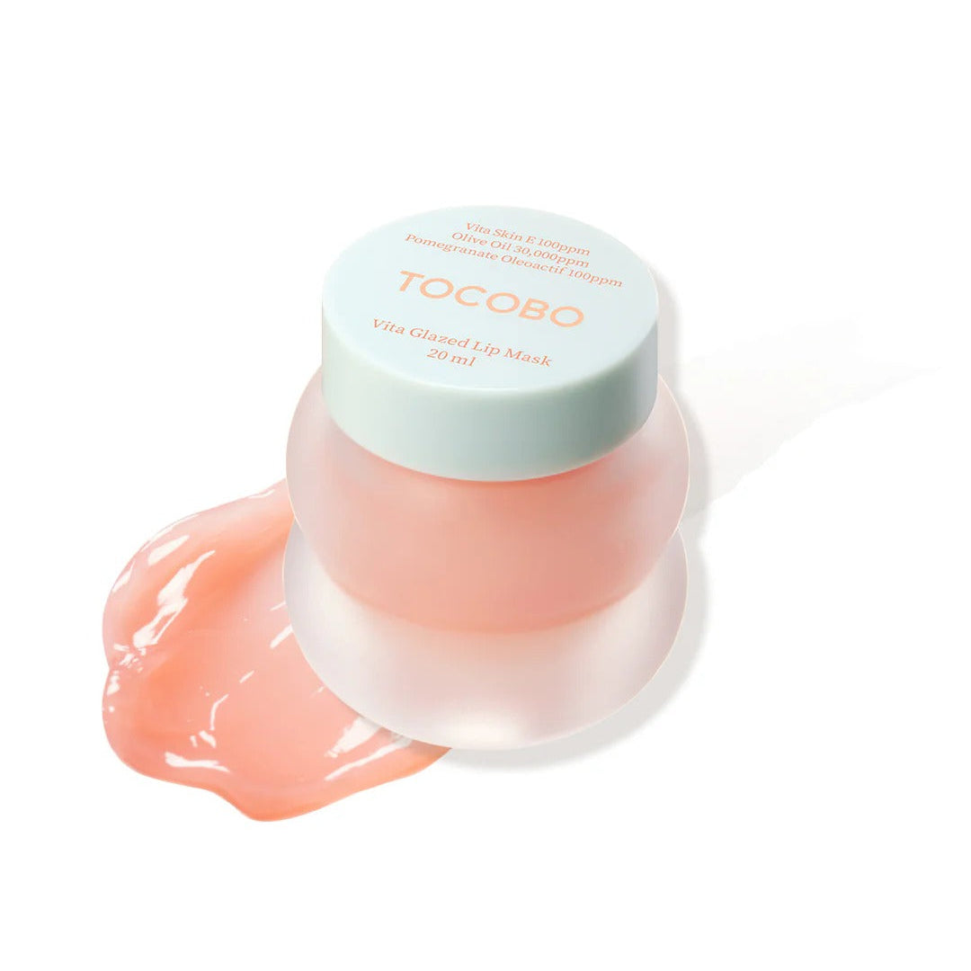Tocoto lip balm with a light green cap on a white background