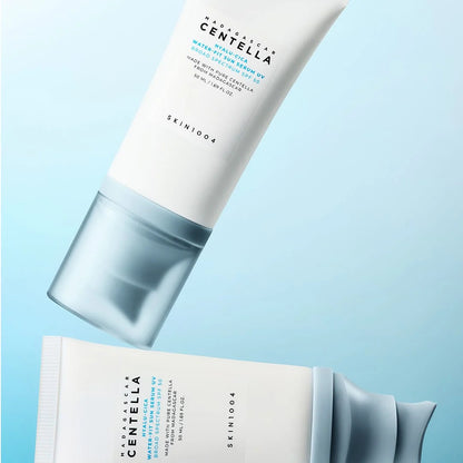 Two skincare products with 'SKIN1004' branding on a light blue background