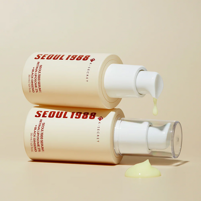 Two bottles of Seoul 1988 Secret serum on a beige background